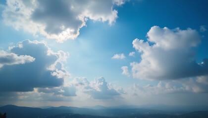 Fototapeta premium Azure Canopy: A picturesque view of a clear sky is painted with soft, billowing clouds. The scene is awash in a radiant display of nature's artistry, captured under a bright sky.