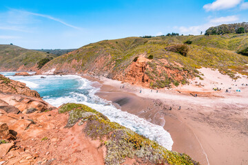 Breathtaking view of Pfeiffer Beach in Big Sur, California, featuring its iconic rock arch, golden sand, and turquoise waves. A stunning coastal landscape perfect for travel and nature lovers