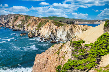 Breathtaking aerial view of Point Reyes, California, showcasing dramatic coastal cliffs surrounded by the Pacific Ocean. A stunning destination for nature lovers, photographers, and outdoor