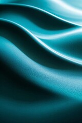 a close up of a blue silk background with a smooth wave