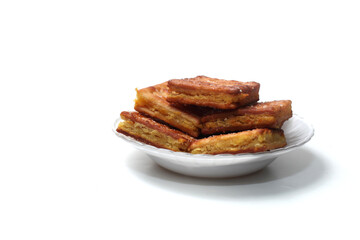 Gabin Tape, Indonesian traditional snack. Fried crackers filled with mash fermented cassava, isolated on white background