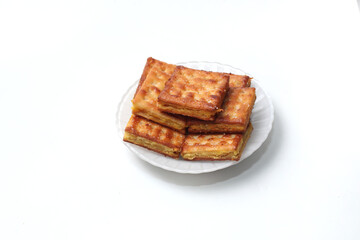 Gabin Tape, Indonesian traditional snack. Fried crackers filled with mash fermented cassava, isolated on white background