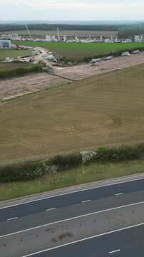 High Angle Footage of Countryside Landscape at Village of Coventry City of England United Kingdom. Aerial View Was Captured with Drone's Camera During Clear Sunny Day of March 30th, 2024