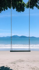 Empty swing on a beach under a sunny sky