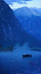 Misty lake nestled between majestic mountains at dawn