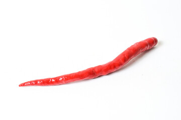 Close up view of one (1) fresh red chili pepper isolated on white background. Clipping path.