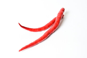 Close up view of two (2) fresh red chili peppers isolated on white background. Clipping path.