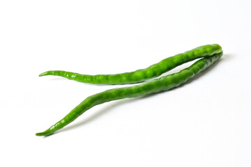 Close up view of two (2) fresh green chili peppers isolated on white background. Clipping path.