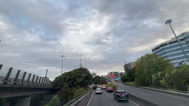 Heavy traffic in Auckland Downtown New Zealand.60 percent of New Zealand households owned two or more cars and cars ownership rate was 837 light vehicles per 1000 people.