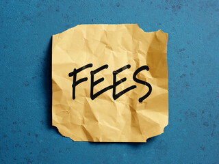 Crumpled note showing fees concept on blue background