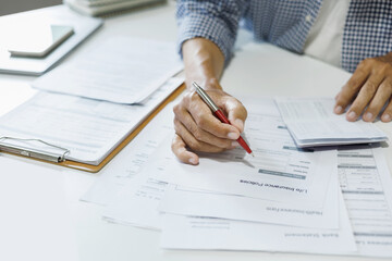 asian man reading contract making deal with life insurance agent before sign. concept for consultant health insurance, life insurance savings plan