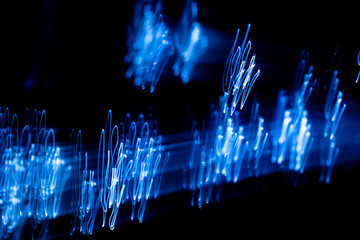 Light trails creating a wavy pattern resembling an oscillating signal or sound wave, perfect for...