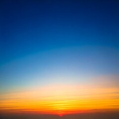 穏やかな夜明けの空と柔らかい朝日のグラデーション