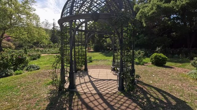 footage of a gorgeous spring landscape with a gazebo, colorful flowers and lush green trees and plants at Descanso Gardens La Canada Flintridge California USA