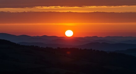 Fototapeta premium Fiery Sunset Over Rolling Hills: A Serene Landscape