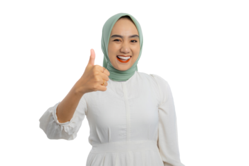 Happy young Asian woman in green hijab and white blouse giving thumbs up and smiling broadly isolated on transparent background