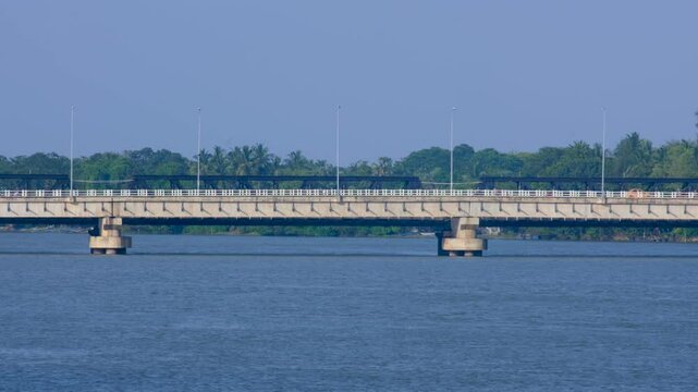 Scenic view of New Kallady Bridge over lagoon water in Batticaloa Sri Lanka with busy traffic