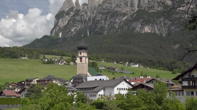 View of V&ouml;ls am Schlern - Fi&egrave; allo Sciliar, South Tyrol, Italy on a sunny day in spring