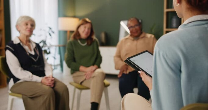 Elderly women, caregiver and tablet for support group in home with advice, therapy and wellness. Senior people, therapist and tech with health education, help and counseling for arthritis or grief