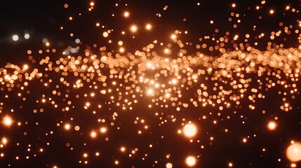 Golden particles stream across a dark backdrop.