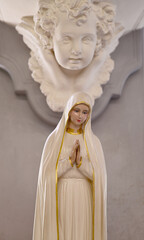 Close up of Statue of Our lady of grace virgin Mary in the church, Thailand. selective focus.