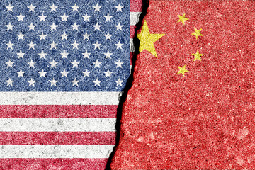 Sino American tension and conflict. A geopolitical crack, split shows US and China flags on wall....