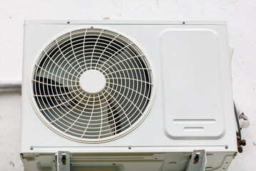 A white air conditioner with a white fan