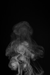 White smoke swirls in abstract form, photography style on black background. Concept of mystery and creativity. Swirling, writhing smoke to overlay on your photos