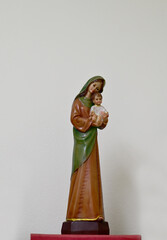 Closeup of Statue of Our lady virgin Mary with Child Jesus located in front of the catholic church with natural background, Thailand. selective focus.