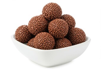 Round chocolate truffles with sprinkles in white bowl isolated on white background
