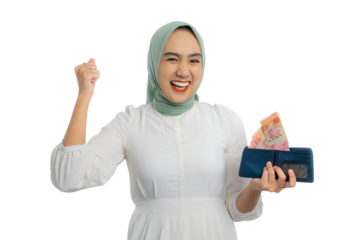 Excited young Asian woman in green hijab and white blouse holding cash in wallet and raising fist up isolated on transparent background