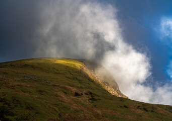 Early morning light and moody weather on mountain area