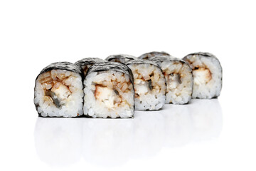 Traditional sushi rolls with smoked eel and rice on white background