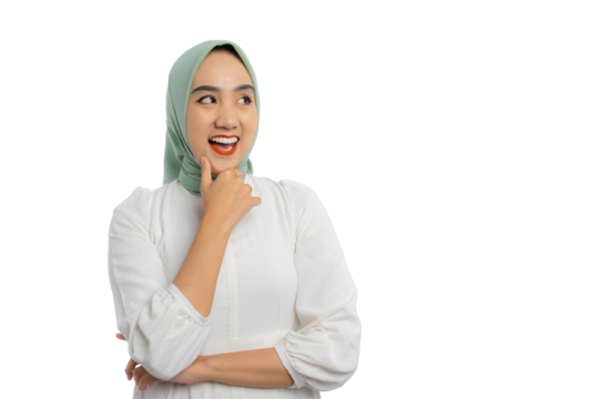 Happy young Asian woman in green hijab and white blouse looking aside at empty space, touching chin, thinking of new good opportunities isolated on transparent background
