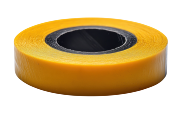 Yellow tape roll sits on a table ready for various DIY projects and repairs