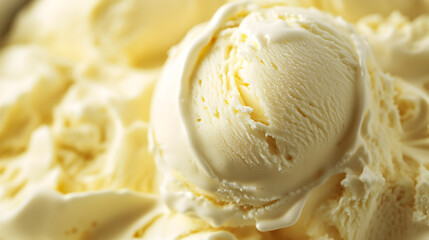 A large scoop of vanilla ice cream sits in a bowl