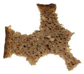 Isolated bitten rye artisan bread on white background