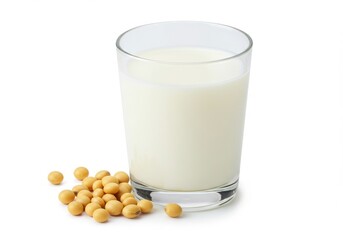 A glass of soy milk with a small pile of soybeans on a white surface in a studio setting view