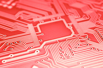 printed red orange circuit board. layout of tracks