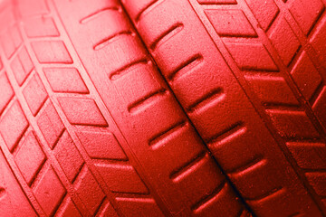 tire tread, red orange tire traces background.