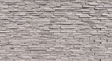Obraz premium Detailed natural stone wall surface showing variations in brown and yellow colored rocks ideal backdrop material