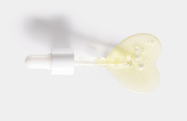 pipette drop of serum test on a light background