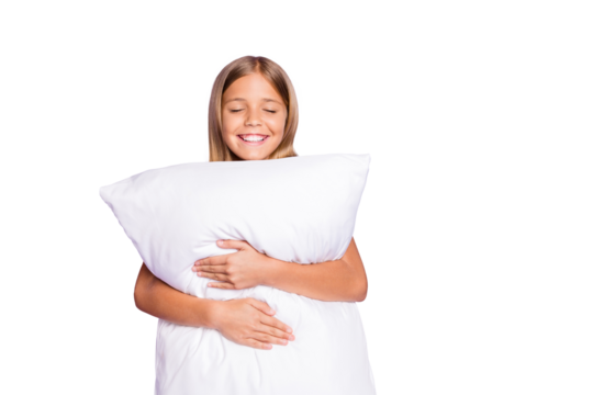 Portrait of positive cheerful kid enjoy bed time hug embrace her pillow have weekends nap feel sleepy daydreaming isolated over violet purple color background
