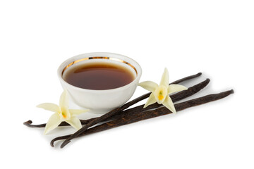 Vanilla extract in glassware isolated on white background. Vanilla extract for baking and desserts. Aromatic Homemade Vanilla Extract. Close -up. Place for the text. Copy space.