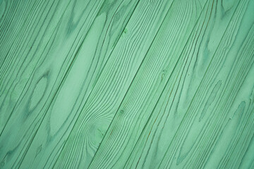 Diagonal green wooden planks with natural wood grain pattern. Painted timber texture background. Studio mockup template for wallpaper, poster, banner, card, and interior design