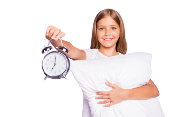 Portrait of positive relaxed blonde hair preteen model girl hold hand pillow clock show early time want hurry to school wear white t-shirt isolated over violet purple color background