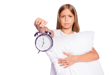 Oh 7 oclock again! Portrait of upset disappointed beautiful kid hug hold hand pillow show clock early time dont want awake and go study wear white t-shirt isolated over purple violet color background