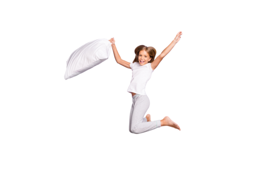 Full length photo of funky funny kid jump raise pillow have fun on comfort expression cozy sleep-over party play game with friends wear white t-shirt pants barefoot isolated purple color background