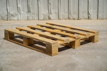 Wooden Pallet on Industrial Ground with Metal Siding Background