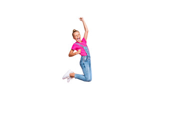 Full length body size photo of trendy cheerful ecstatic girl rejoicing with victory jumping crazily isolated over pastel pink color background